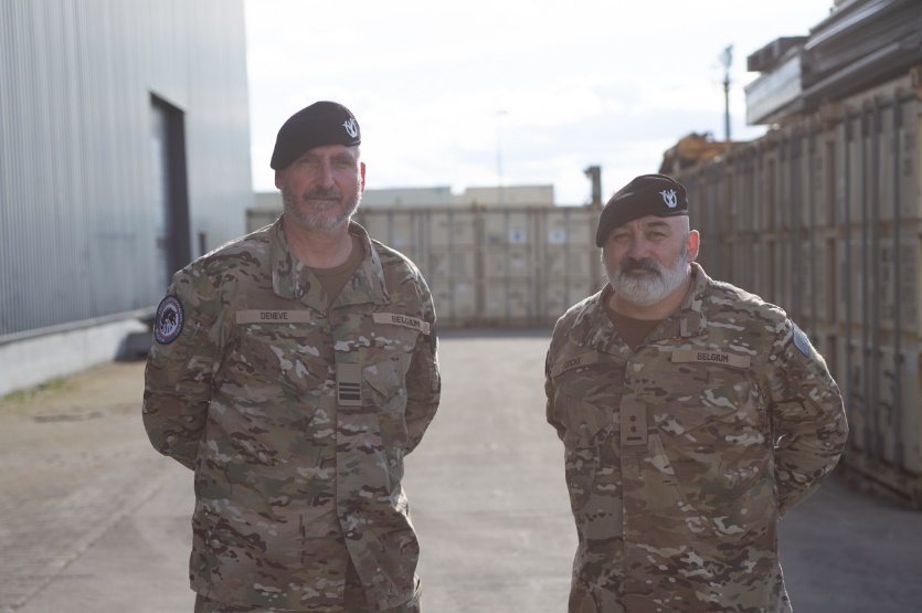 A couple of men in military uniforms

Description automatically generated