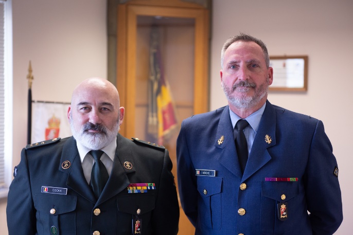 A couple of men in military uniforms
Description automatically generated